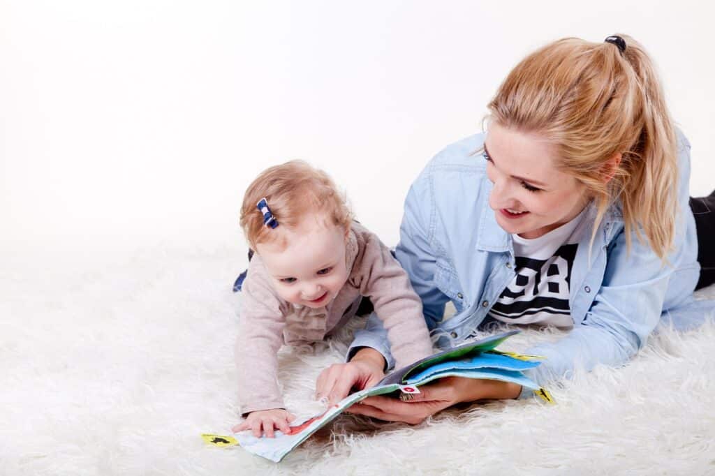 mother reading to baby