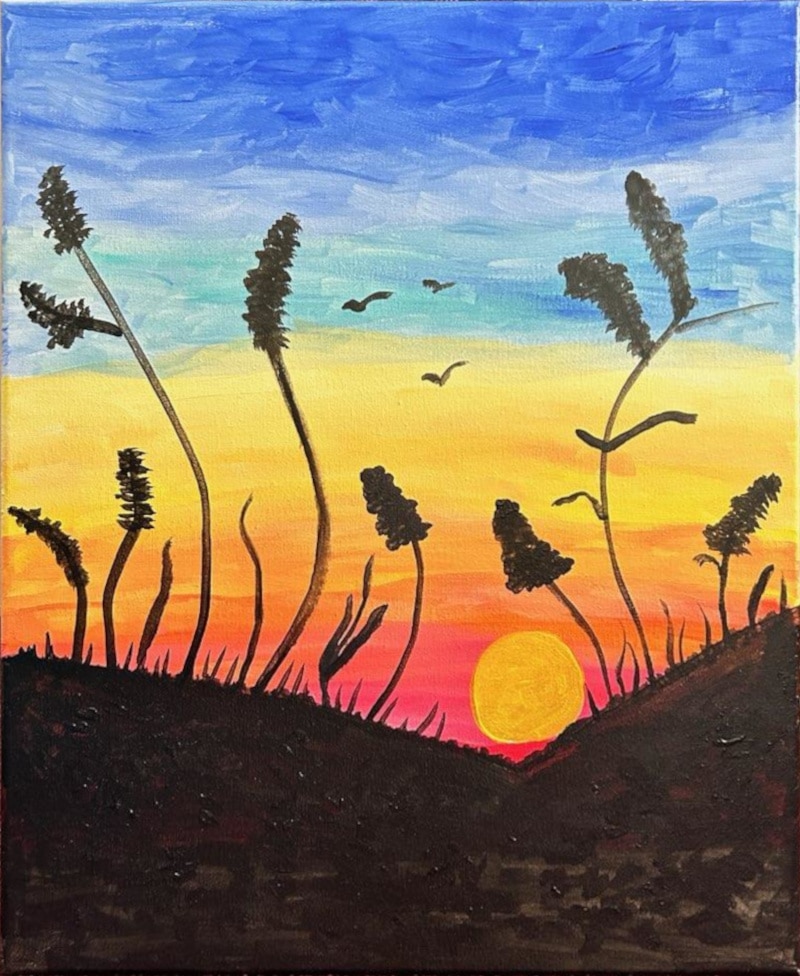 A canvas painting with a Kansas sunset in the background and stalks of wheat in the background.